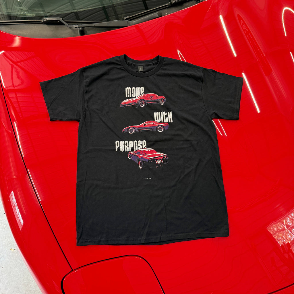 Black t-shirt with car graphics on a red car hood